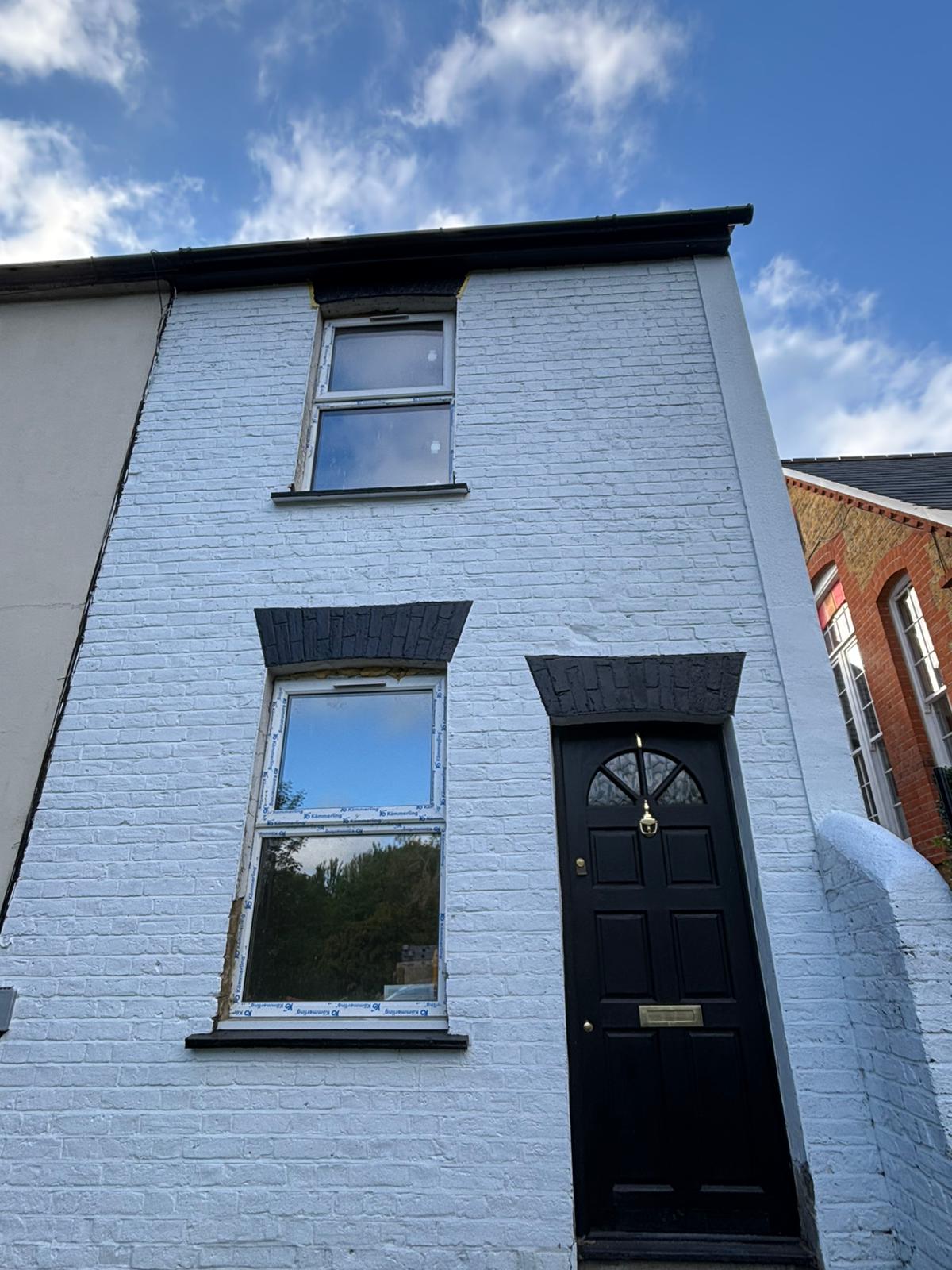White-painted Victorian cottage front