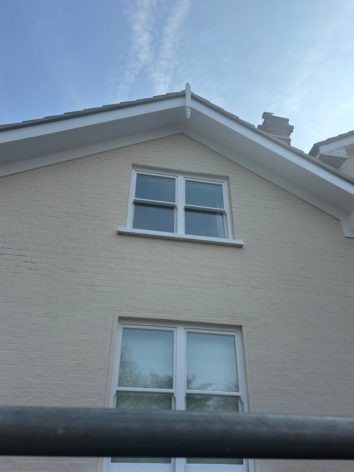 Cream-painted gable end with clean fascia